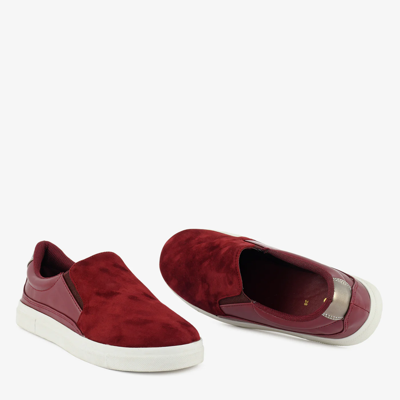 Women’s maroon slip-on sneaker with suede finish upper and white rubber sole