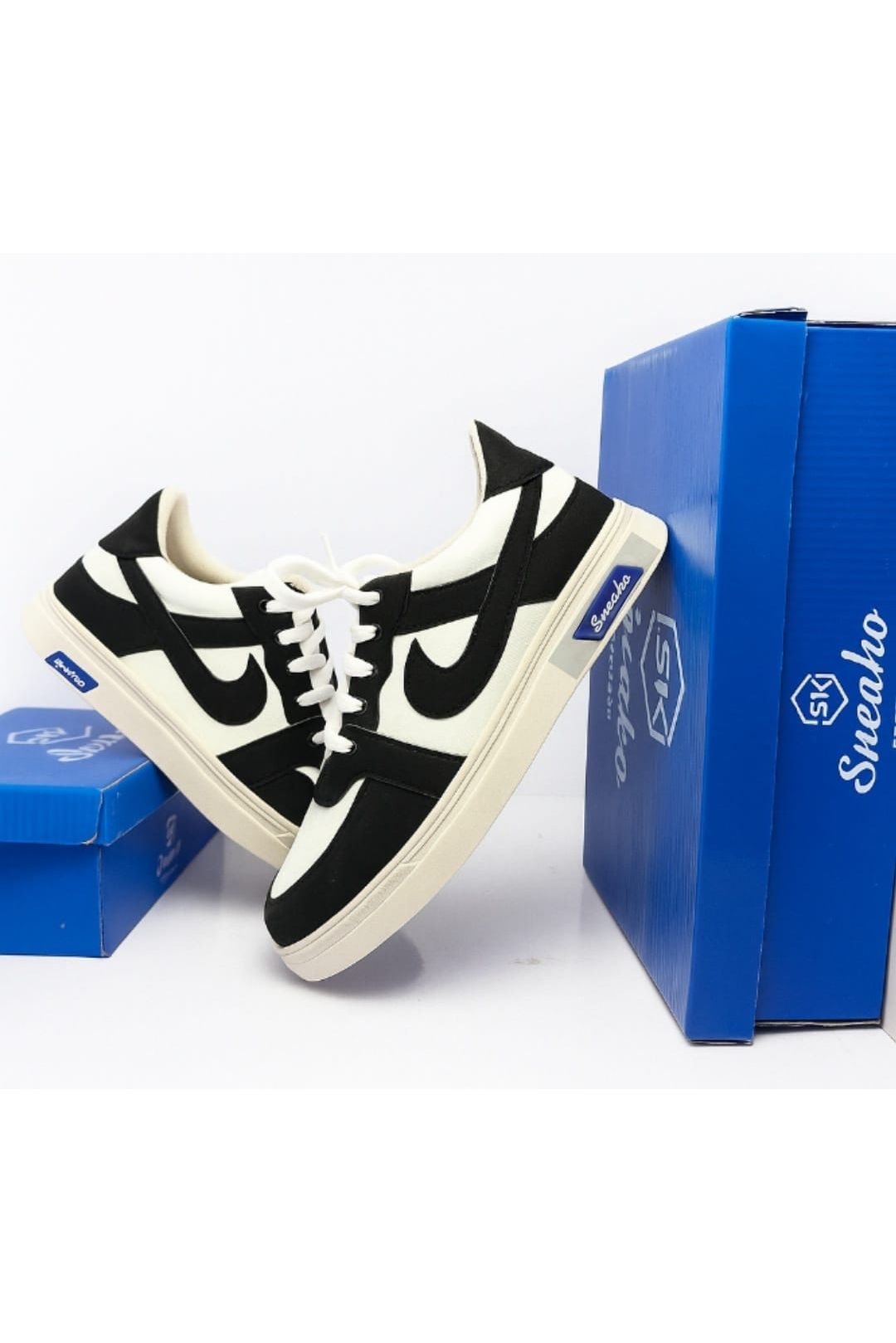 Stylish casual sneakers on blue cone display